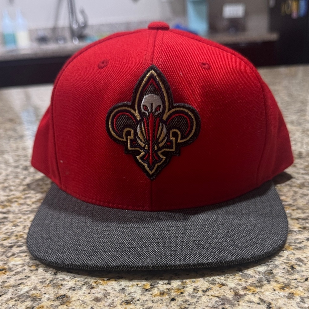 Red and Grey SnapBack with Fleur-de-lis Pelicans logo